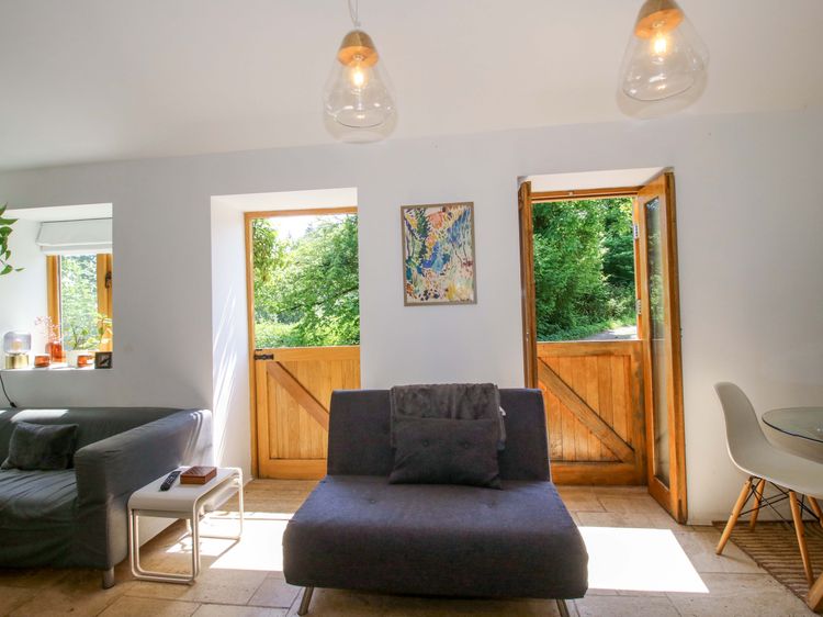 Light walls and timber doors in the living room